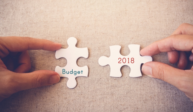 Two jigsaw puzzles pieces representing budget 2018