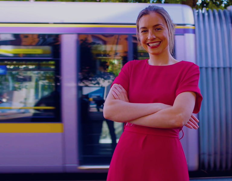 Working at Davy image of a person standing in front of the Luas