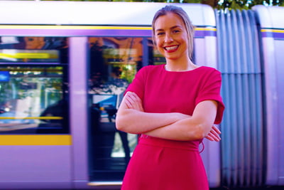 Working at Davy image of a person in front of a Luas