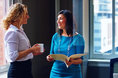 Longe term partnerships image of two people chatting