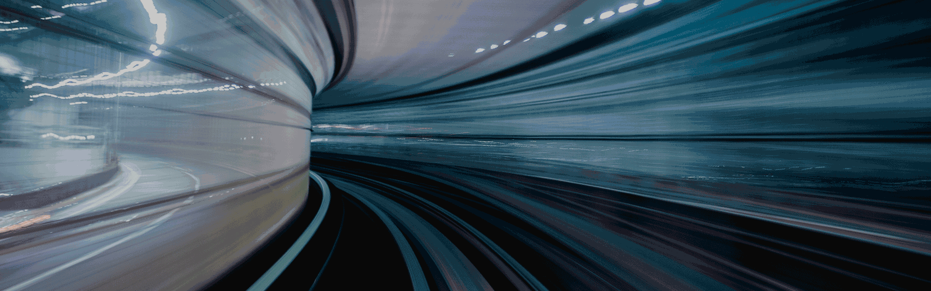 Mergers and acquisitions report banner of a train tunnel at speed