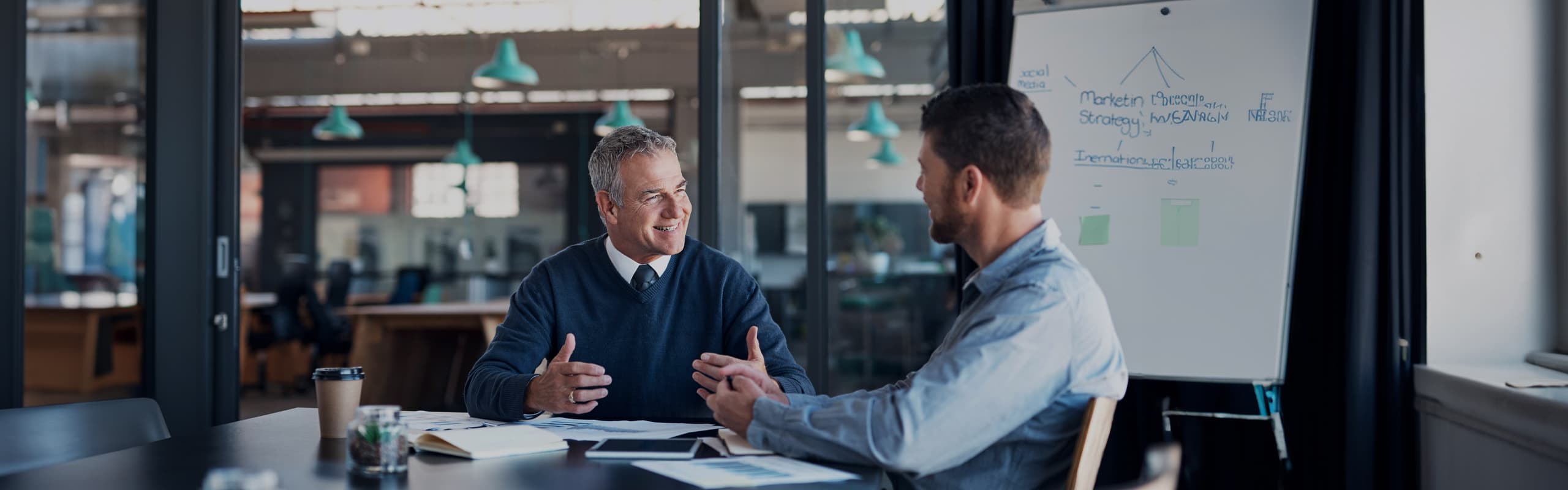 Business sucession plannig image of a father and son planning their day