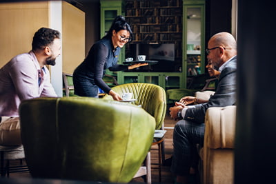 Business sucession planning image of business people on coffee break