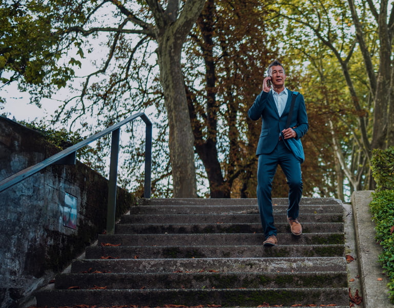 Credit unions newslterr image of a person walking down some stairs
