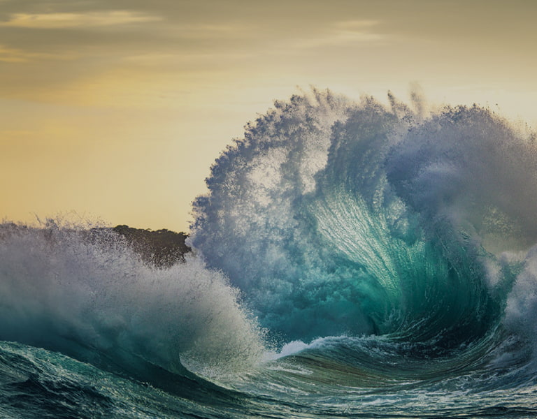 Sustainable investing image of a large wave in the sea