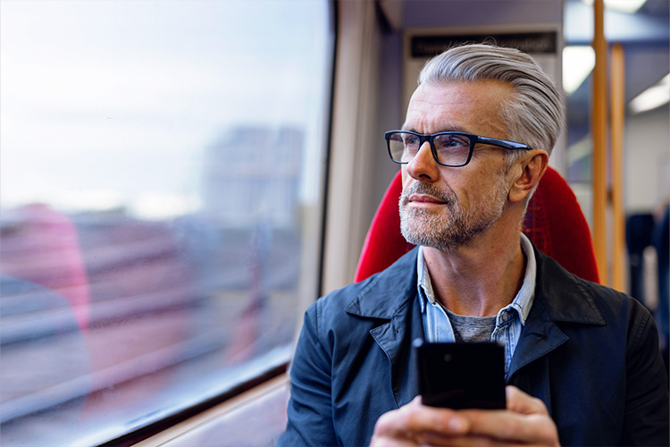 Pension Consolidation, man on a train looking out the window