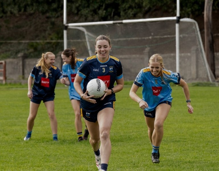 Local sponsorships banner image, girls playing GAA football