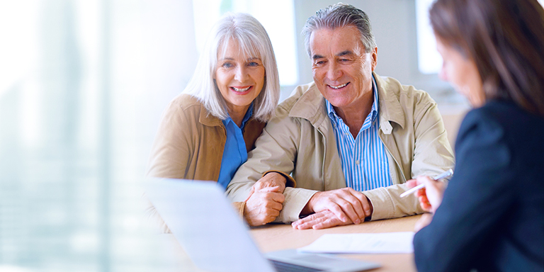 Selling a business in ireland image of a couple looking at a laptop screen