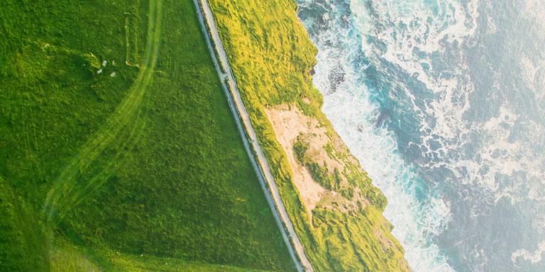 Climate change image of the sea meeting a green coast