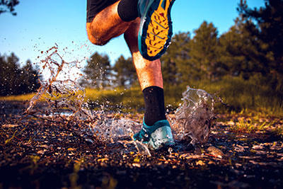wealth management and financial goals image of someone running through a forrest