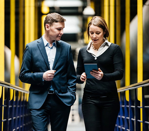 ESOP image of two buisiness people walking down a walkway