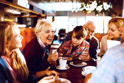 Financial planning benefits image of a family enjoying a meal