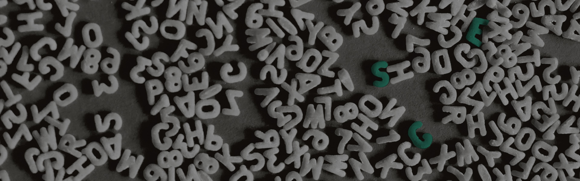 The ABCs of ESG, image of grey letters with the letters E, S and G in green