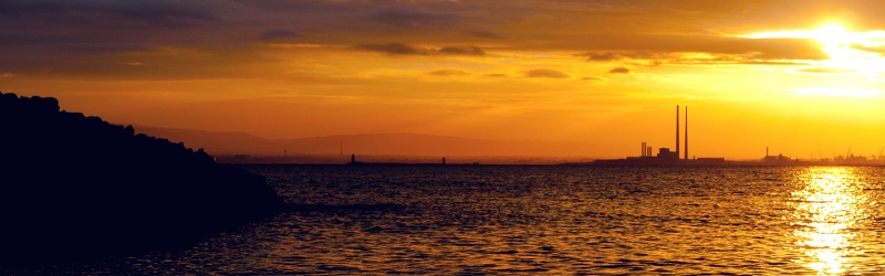 TCFD and the Evolution of Non-Financial Disclosure for PLCs image of Dublin bay and poolbeg at sunset