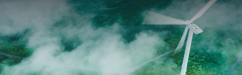 Image of a wind mill behind fog