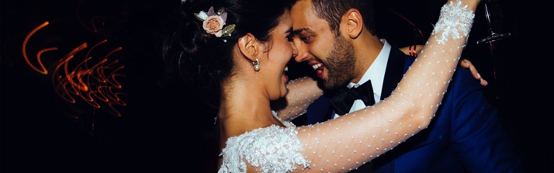 Image of happy bride and groom dancing