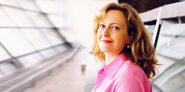 PRSA image of a smiling person in a pink shirt