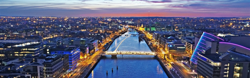 Budget 2026 Dublin skyline at night over the river Liffey