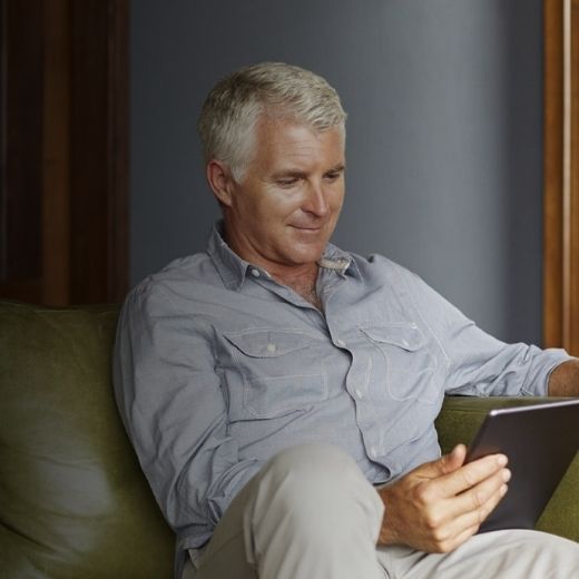 Man reading iPad