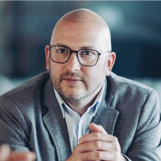 Budget 2027 aimed to support business owners, man listening in a meeting
