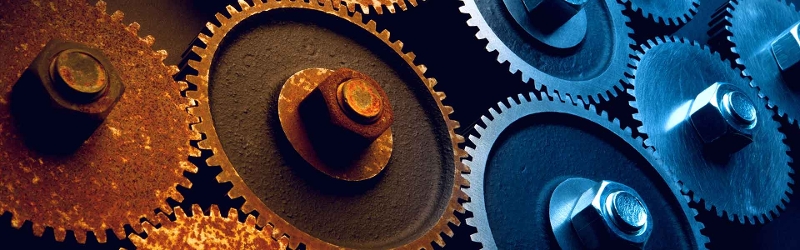 Traditional investment advice has had a bad decade. image shows rusty metals cogs next to shiny brand new cogs.