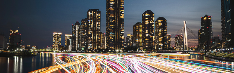 City skyline with time lapse of traffic headlights