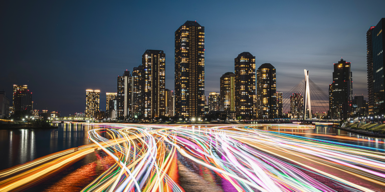 City skyline with time lapse of traffic headlights