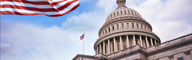 US Congress building and American flag