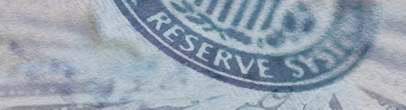 Federal Reserve badge and US dollar