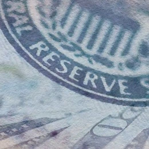 Federal Reserve badge and US dollar