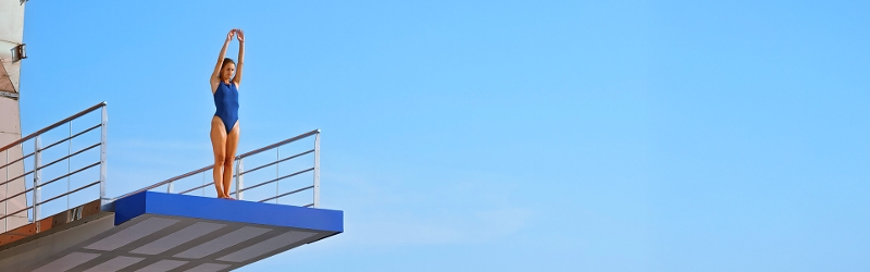 Image of woman about to dive off diving board