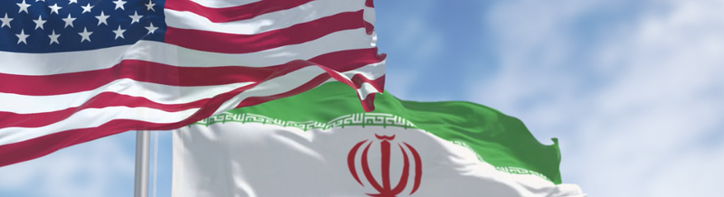 US and Iran flag waving in the wind