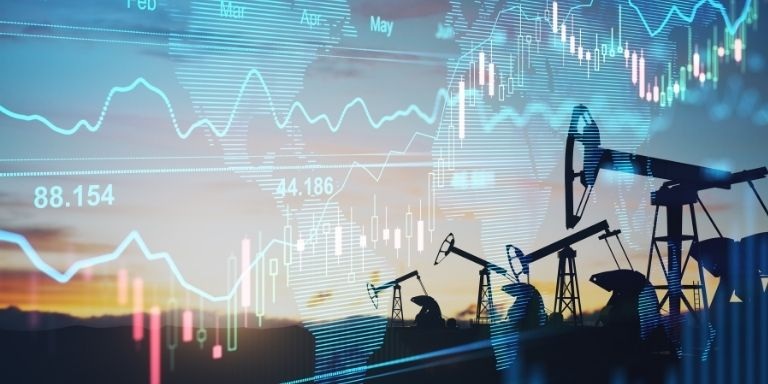 Oil mining machinery against a blue backdrop of graphs and bar charts
