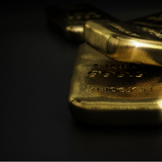 Gold bars on a black backdrop