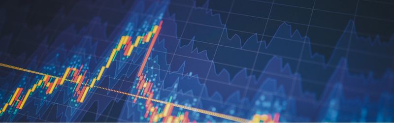 Image shows a financial chart moving up and down