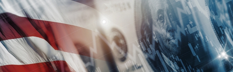 US financial metrics faded onto a background of a flag and dollar bill