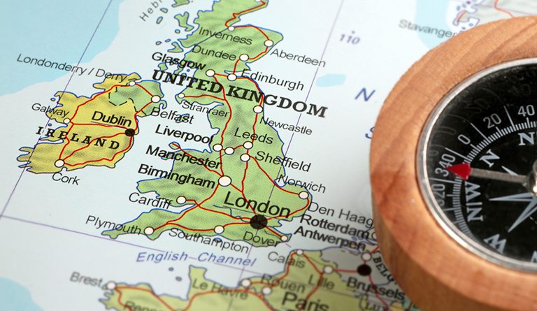 Map of the United kingdom and Ireland accompanied with a compass on the side