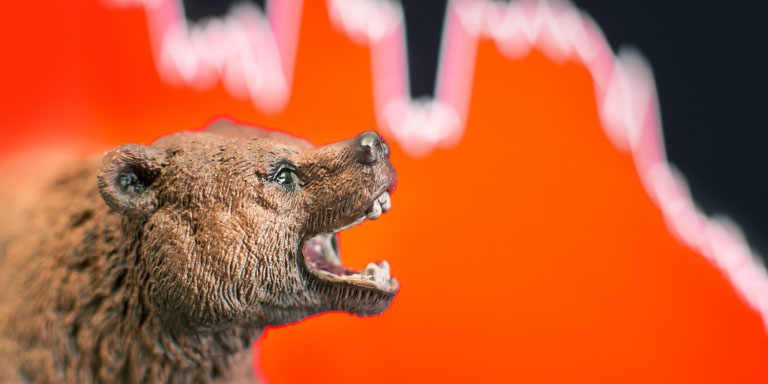 Brown bear roaring at a linear graph