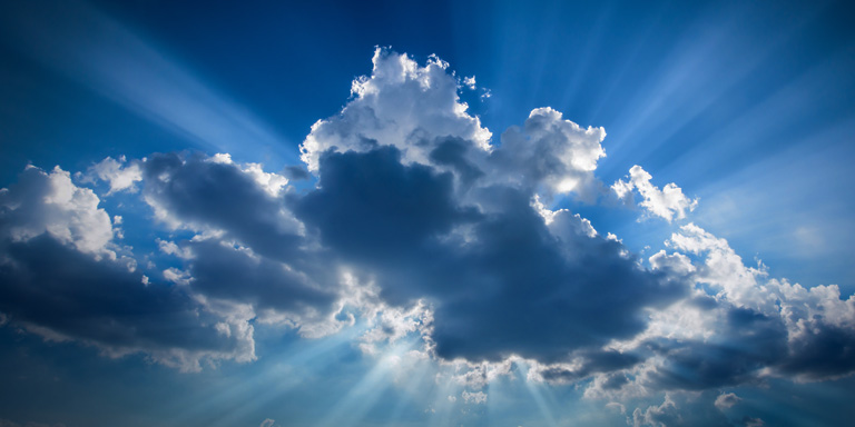 Glimmers of sunlight through the storm clouds