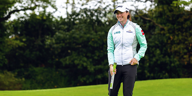 Interview with Leona Maguire. Leona smiles on the golf course.