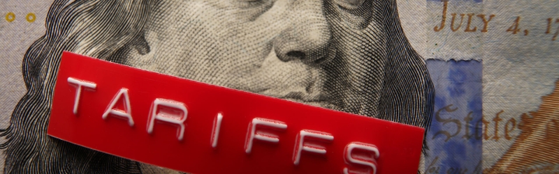 Image of US president on a dollar note with a tarrif sticker over this mouth