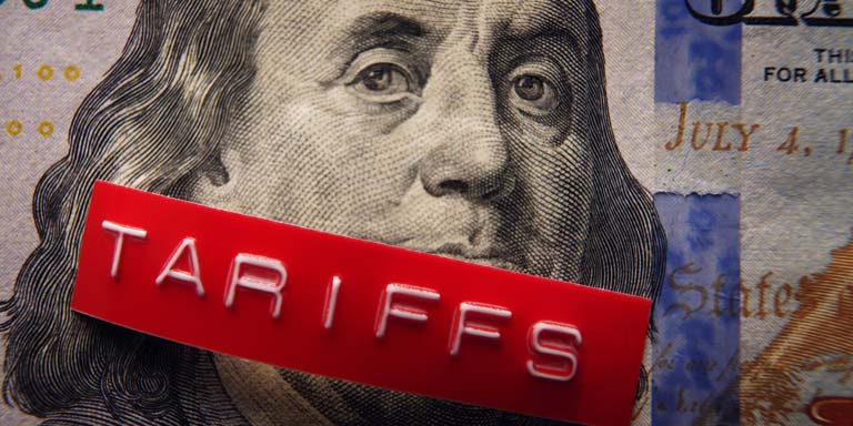 Image of US president on a dollar note with a tarrif sticker over this mouth