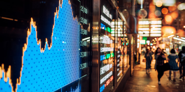 markets image of a chart though a window of a building
